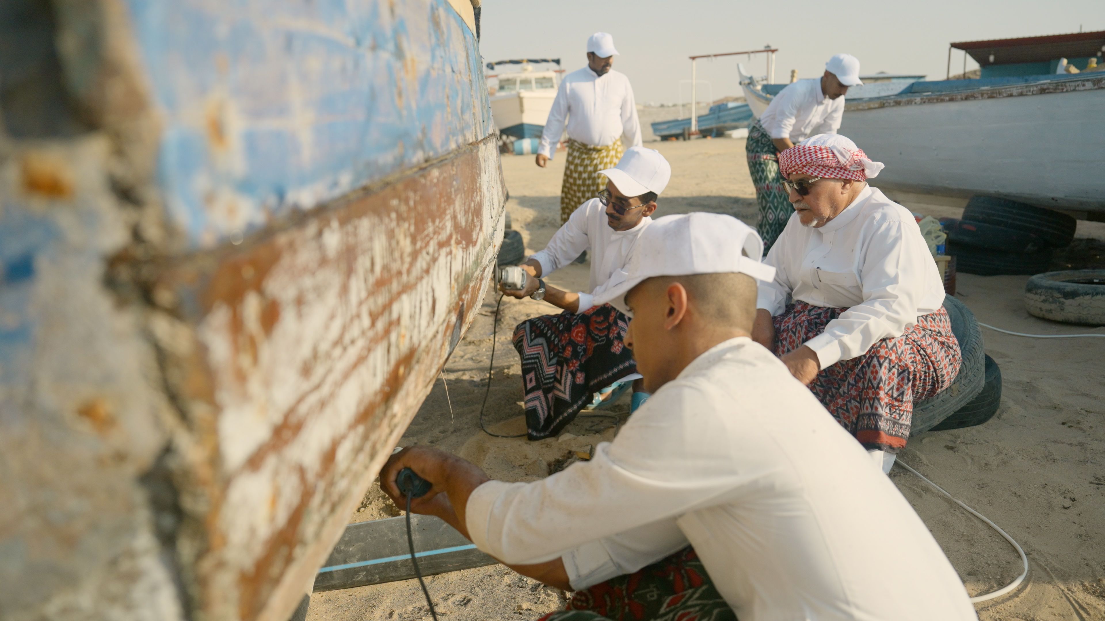 A national initiative launched by Red Sea Global and the Tamkeen Association involves young apprentices learning the intricate skills of boat restoration and construction.