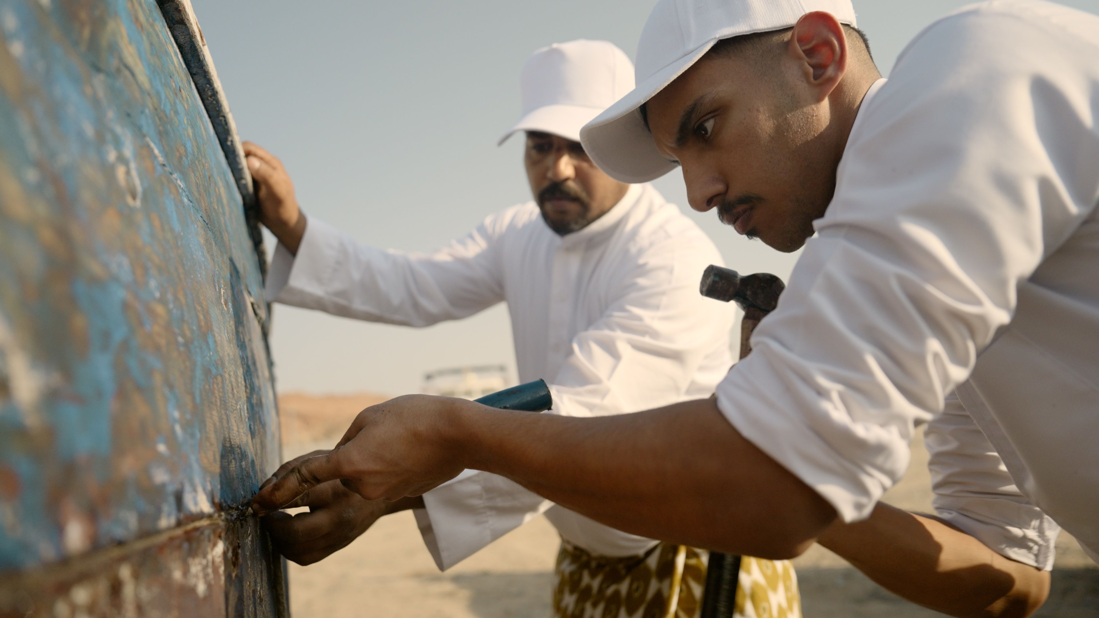 Young apprentices restore the old boats and construct new ones under the expert guidance of a master carpenter.